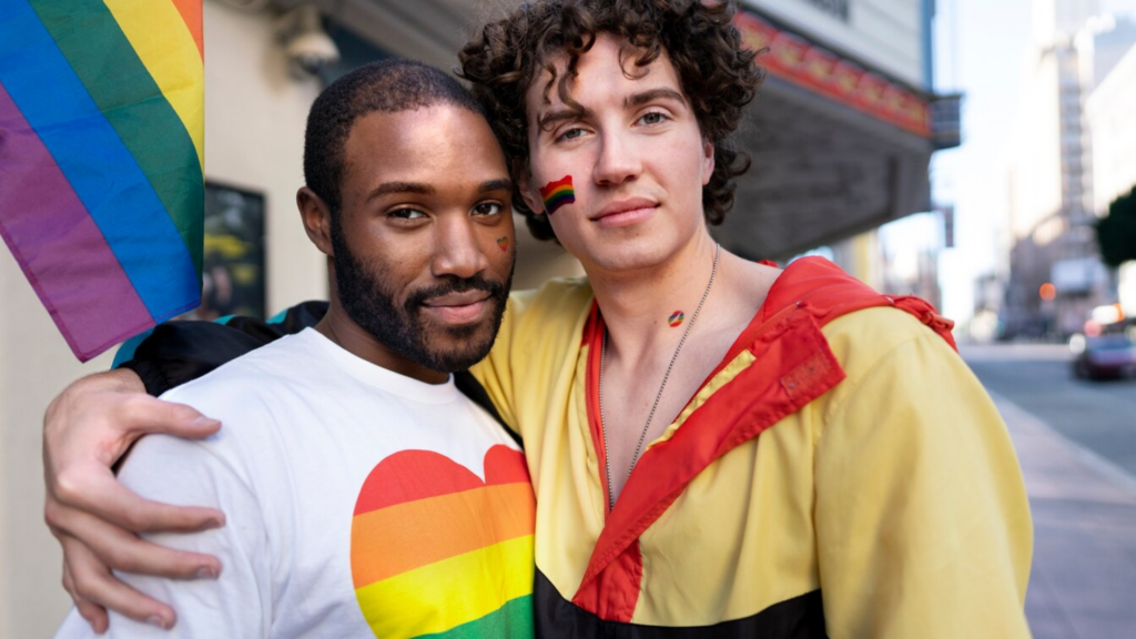 An image of two gay men embracing with pride, a manifestation of genuine happiness after healing from rejection as a gay man or lgbtq person.