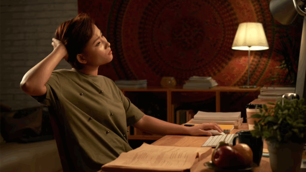 An asian lesbian trying to working late at night.