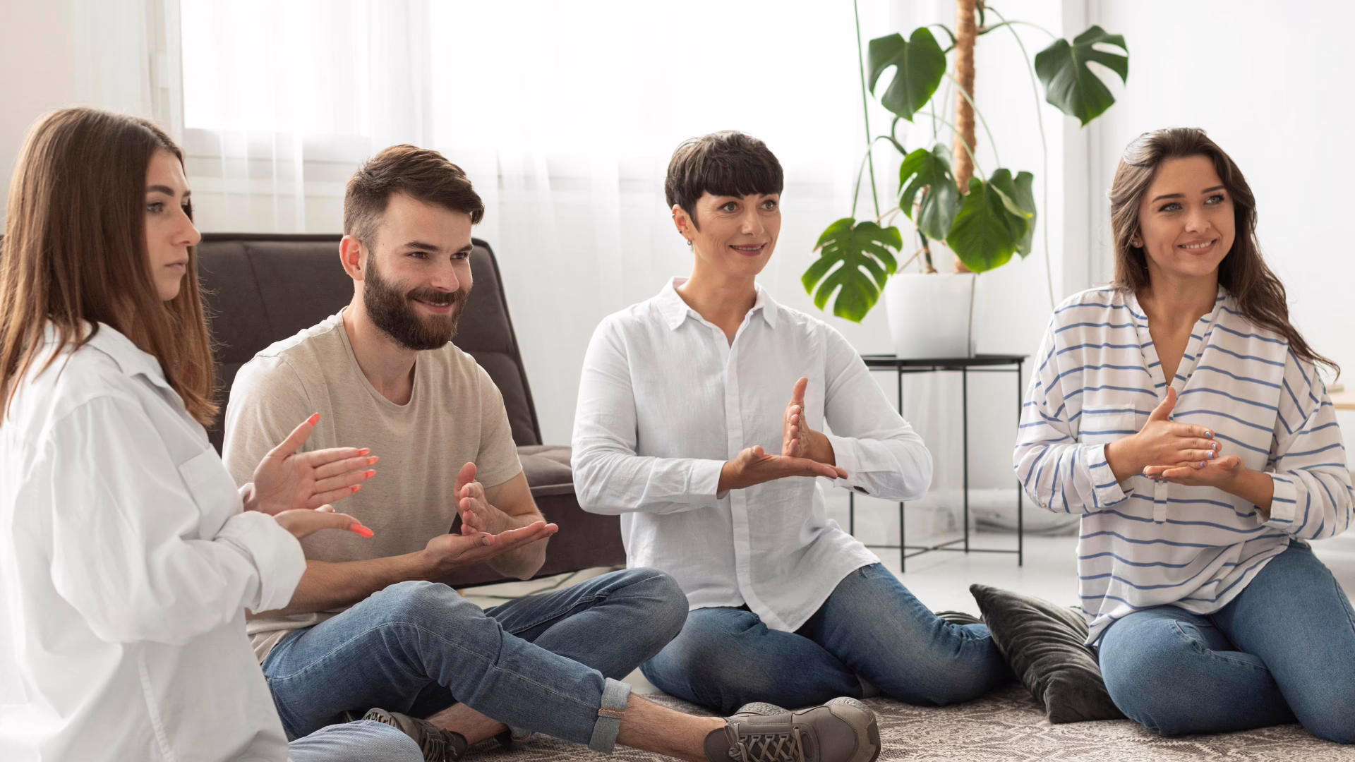 A group of LGBTQ individuals during a therapeutic group therapy.