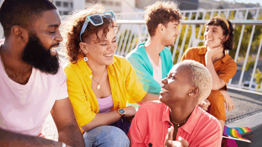LGBTQ friends smiling together outdoors, representing affirming care and connection in LGBTQ-inclusive detox recovery